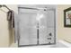 Clean shower with glass enclosure and bright tile at 169 Marsh Island Dr, Kiawah Island, SC 29455