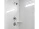 White tiled shower with modern fixtures at 197 Denham St, Summerville, SC 29486