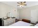 Bright bedroom with dresser, ceiling fan, and ample closet space at 45 Sycamore Ave # 637, Charleston, SC 29407