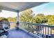 Relaxing balcony with wicker chair and wooded views at 45 Sycamore Ave # 637, Charleston, SC 29407