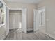 Bedroom with grey flooring, double doors to a closet, and access to another room at 164 Aleene Drive Dr, Summerville, SC 29485