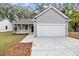 Gray house with a white garage door and small porch at 164 Aleene Drive Dr, Summerville, SC 29485