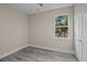 Bright bedroom with grey flooring and a window offering backyard views at 164 Aleene Drive Dr, Summerville, SC 29485
