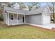 Gray siding house with a white garage door and front porch at 164 Aleene Drive Dr, Summerville, SC 29485