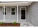 Dark brown front door with sidelights and a porch at 164 Aleene Drive Dr, Summerville, SC 29485