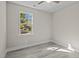 Bedroom with grey flooring, a window, and white trim at 164 Aleene Drive Dr, Summerville, SC 29485