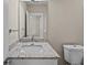 Modern bathroom with granite countertop, white vanity, and a toilet at 164 Aleene Drive Dr, Summerville, SC 29485