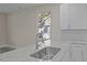 Kitchen sink and granite countertop with white cabinets at 164 Aleene Drive Dr, Summerville, SC 29485
