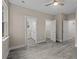 Main bedroom with grey flooring and access to the bathroom and closet at 164 Aleene Drive Dr, Summerville, SC 29485