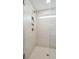 Spa-like shower with herringbone floor, built-in shelves, and frameless glass enclosure at 180 Cantona Dr, Summerville, SC 29483