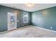 Bedroom with gray walls, carpet, and a door to an exterior balcony at 218 Symphony Ave, Summerville, SC 29486