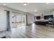 Bright living room with hardwood floors and sliding glass doors to patio at 218 Symphony Ave, Summerville, SC 29486