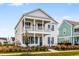 Two-story home with blue shutters and a porch at 218 Symphony Ave, Summerville, SC 29486