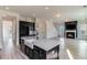 Spacious kitchen with a large island, stainless steel appliances, and farmhouse sink at 218 Symphony Ave, Summerville, SC 29486