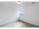 Simple bedroom with gray carpet and a window with natural light at 218 Symphony Ave, Summerville, SC 29486