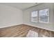 Bright bedroom with two windows and wood-look floors at 121 Trumpet Vine Dr, Summerville, SC 29483