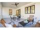 Relaxing screened porch with seating area and ceiling fan at 6052 Honey Hole Haven, Johns Island, SC 29455