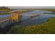 Aerial view of a gazebo and dock on a tranquil waterway at 6052 Honey Hole Haven, Johns Island, SC 29455