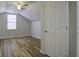Charming bedroom with sloped ceilings, wood floors and a window at 118 Malibu Rd, Summerville, SC 29483