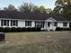 Ranch home with white siding and black shutters at 143 Fisk Rd, Dorchester, SC 29437