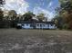 Back of house, showcasing a sunroom and large backyard at 143 Fisk Rd, Dorchester, SC 29437