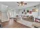 L-shaped sofa, hardwood floors, and stairs to second floor at 1600 Windsor Ln, Moncks Corner, SC 29461