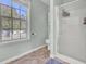 Clean bathroom with shower, toilet and large window at 1600 Windsor Ln, Moncks Corner, SC 29461
