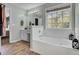 Main bathroom with soaking tub and separate shower at 1600 Windsor Ln, Moncks Corner, SC 29461