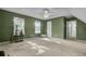 Large bedroom with gray carpet, two windows, and access to bathroom at 1600 Windsor Ln, Moncks Corner, SC 29461