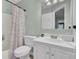 Simple bathroom with shower/tub combo and white vanity at 1600 Windsor Ln, Moncks Corner, SC 29461