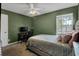 Bedroom with a queen bed, workspace, and green walls at 1600 Windsor Ln, Moncks Corner, SC 29461