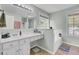 Bathroom with double vanity, soaking tub, and large window at 1600 Windsor Ln, Moncks Corner, SC 29461