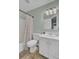 Clean bathroom with white vanity, shower/tub combo, and tile floor at 1600 Windsor Ln, Moncks Corner, SC 29461