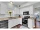 Modern kitchen with granite countertops, white cabinets, and stainless steel appliances at 1600 Windsor Ln, Moncks Corner, SC 29461
