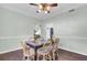 Bright dining room features hardwood floors and a wood table with chairs at 1600 Windsor Ln, Moncks Corner, SC 29461