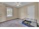 Simple bedroom with ceiling fan and large window at 1600 Windsor Ln, Moncks Corner, SC 29461