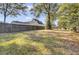 Fenced backyard with grassy area and home view at 1600 Windsor Ln, Moncks Corner, SC 29461