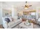 Open concept living room and kitchen with hardwood floors and stainless steel appliances at 235 Cooper River Dr, Mount Pleasant, SC 29464
