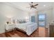 Comfortable bedroom with hardwood floors, city views, and access to balcony at 235 Cooper River Dr, Mount Pleasant, SC 29464