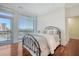 Bedroom with metal bed frame, hardwood floors, and balcony view at 235 Cooper River Dr, Mount Pleasant, SC 29464
