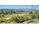 Aerial view of parkland with marsh views and bridge in background at 235 Cooper River Dr, Mount Pleasant, SC 29464