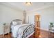 Bedroom with metal bed frame and hardwood floors at 235 Cooper River Dr, Mount Pleasant, SC 29464