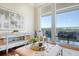 Bright living room with hardwood floors, city views, and access to a balcony at 235 Cooper River Dr, Mount Pleasant, SC 29464