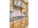 Gas cooktop and stainless steel range hood in a kitchen with light wood cabinets at 235 Cooper River Dr, Mount Pleasant, SC 29464