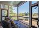 Relaxing screened porch with wooded views and comfortable seating at 1999 N Creek Dr, Mount Pleasant, SC 29466