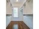 Large walk-in closet with custom shelving and hardwood floors at 1999 N Creek Dr, Mount Pleasant, SC 29466