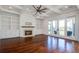 Bright and airy living room with hardwood floors and a fireplace at 1999 N Creek Dr, Mount Pleasant, SC 29466