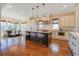 Open concept kitchen with island, stainless steel appliances, and hardwood floors at 1999 N Creek Dr, Mount Pleasant, SC 29466