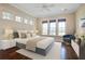 Spacious bedroom with large windows, hardwood floors, and a ceiling fan at 1999 N Creek Dr, Mount Pleasant, SC 29466