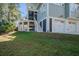 Three-car garage with white doors and a spacious driveway at 1999 N Creek Dr, Mount Pleasant, SC 29466
